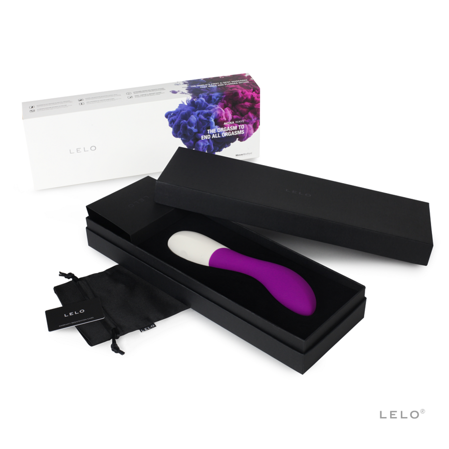 Purple silicone vibrator with curved white tip in black gift box with branded soft pouch and white floral packaging.