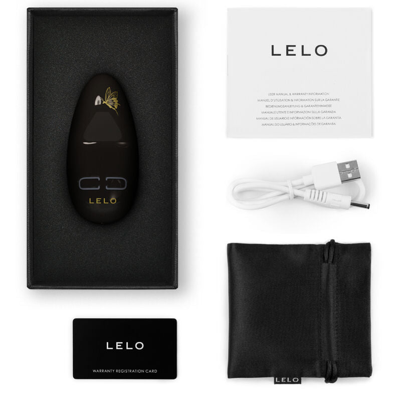 Black LELO Nea 3 personal massager in box with USB charging cable, black pouch, and manuals.