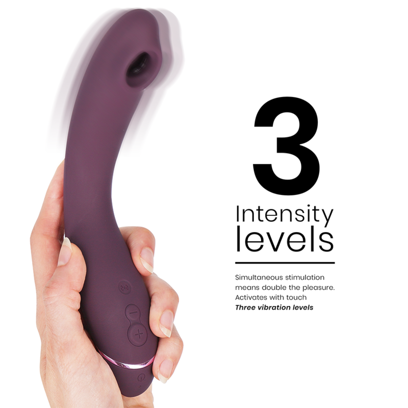 Aubergine curved G-spot vibrator with ergonomic handle and three control buttons held in hand, white background.