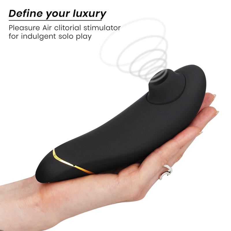 Black ergonomic clitoral stimulator with gold accent held in hand, air pulse technology visible.