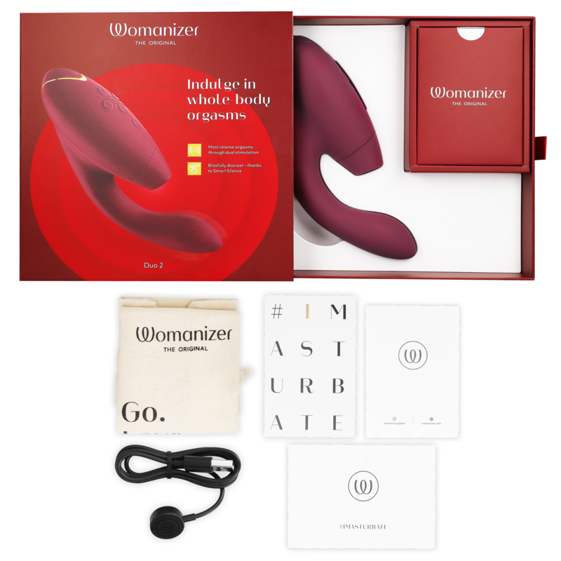 Bordeaux dual stimulator with ergonomic design, red packaging, USB charger, storage pouch, and user manuals.