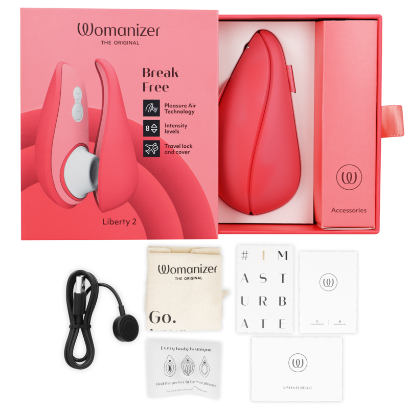 Pink Womanizer Liberty 2 clitoris stimulator with box, USB charging cable, and storage pouch.