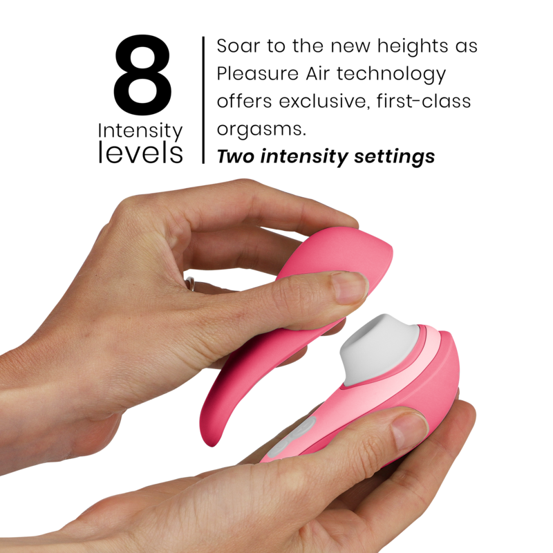 Pink Womanizer Liberty 2 clitoris stimulator with ergonomic design held in hand.
