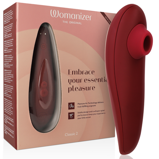 Bordeaux Womanizer Classic 2 clitoral stimulator with ergonomic curved design and silicone tip next to matching packaging box.