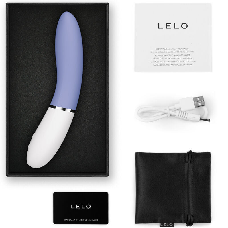 Blue and white curved G-spot stimulator with USB charging cable, black storage pouch, and instruction manual in black box.