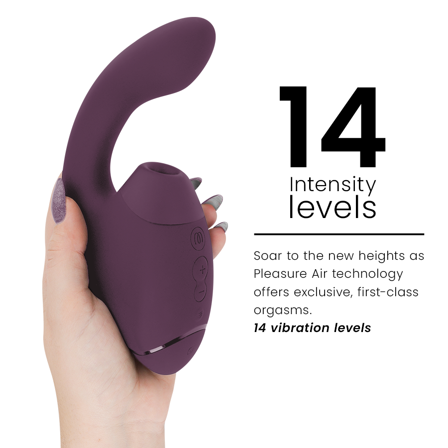Dark purple dual clitoral and G-spot stimulator with curved design and control buttons held in hand.