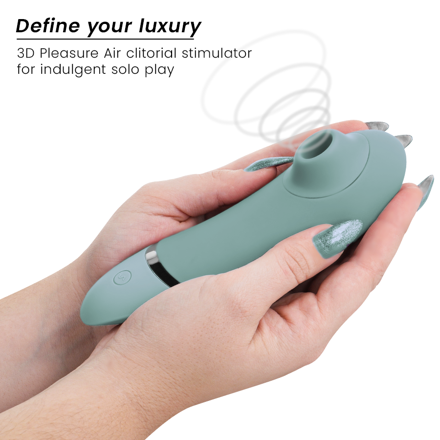 Sage green clitoral stimulator with ergonomic design held in hands, featuring silicone texture and control button.