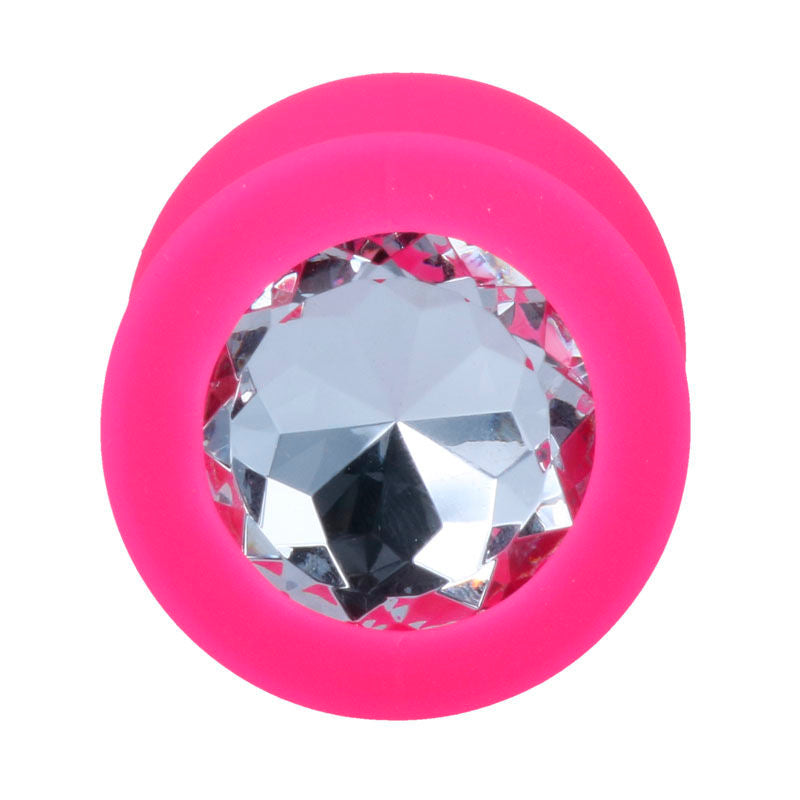 Fuchsia silicone plug with large clear faceted gem base.